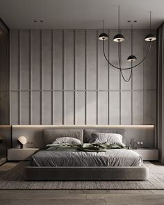 a large bed sitting in the middle of a bedroom next to a wall mounted light