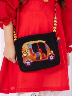 Add a touch of ethnicity to your attire with this beautifully embroidered girls potli bag. Perfect for any occasion, this clutch style purse features intricate Indian-inspired accents that bring a unique charm to your outfit. Ideal for women who love to keep their essentials close, this bag is a must-have for any cultural event or celebration. Crafted with the finest quality materials, this purse is brand new with tags, ensuring that it will last for years to come. Whether you're attending a wedding, festival, or any other special occasion, this potli bag is the perfect accessory to complete your outfit. Shop now and experience the beauty of Indian culture with this stunning handbag. Size  One size  Embroidered ching chi rikshwa tuk tuk design by Bohemian Multicolor Potli Bag For Diwali, Bollywood Style Festive Bags With Resham Embroidery, Festive Dori Work Shoulder Bag, Traditional Bags With Resham Embroidery For Festive Occasions, Traditional Rectangular Potli Bag For Travel, Traditional Bags With Multicolor Embroidery And Motifs, Rectangular Bags With Mirror Work For Diwali, Bollywood Embroidered Pouch Bag, Bollywood Style Embroidered Pouch Bag