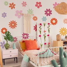 a bedroom with flowers painted on the wall