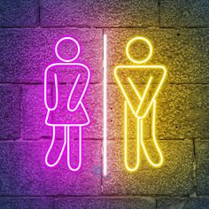 two neon signs on a brick wall that show a man and a woman standing next to each other