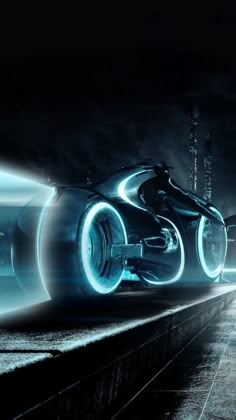 a futuristic car driving through a tunnel with lights on it's sides and wheels