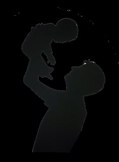 the silhouette of a man holding a baby in his arms, against a white background