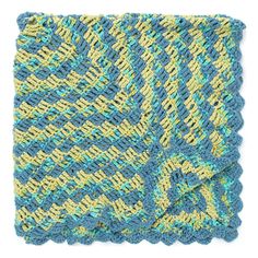 a blue and yellow knitted blanket on a white background