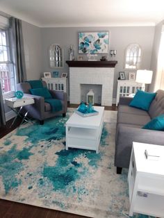 a living room filled with furniture and a fire place in the middle of the room