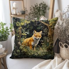 a pillow with a fox on it sitting on a chair next to a potted plant