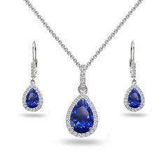 PRICES MAY VARY. FEATURE - Wear this stylish set to enhance your daytime and evening attire. This beautiful jewelry set features dangling pear-cut created blue sapphire gemstones in a white topaz encrusted halo design, for a dazzling evening look. The earrings measure 9.5mm in width & 11.6mm in length and the pendant measures 11.5mm in width & 25mm in length. CRAFTED - This luxurious jewelry set is crafted of fine sterling silver and is nickel & tarnish free. The pendant hangs from a 18 inch rol Dangling Necklace, White Topaz Necklace, Luxurious Jewelry, Halo Design, Topaz Jewelry, Topaz Necklace, Leverback Earrings, Teardrop Necklace, Cross Earrings