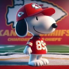 a cartoon dog wearing a football jersey and hat with the kansas chiefs logo in the background