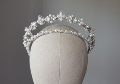 Wedding pearl tiara, kokoshnik  with pearls and crystals. Bridal crown. Available with white or ivory/cream pearls (in menu) ~MATERIALS~ -Austrian crystals (color White clear) -Austrian white pearl beads -Silver tone filigree ~SIZE~ Center height  2 inch (5 cm) ~SHIPPING AND DELIVERY TIME~ This headpiece is ready to ship by 3-5 days The approximate time of shipment: - 10-16 days to Europe - 15-35 days to United States and other countries. ~IMPORTANT INFORMATION~ -Please allow as much time for shipping as possible before your important date ! I can't guarantee shipping time as its beyond my control.  -Rush orders available for a fee. I use EMS express post. Please contact me. ~CUSTOM DESIGN~ If you interesting custom design please message me. I will create something special for you with ple Tiara Silver, Pearl Crown, Crystal Crown Wedding, Crown Silver, Crown Crystal, Silver Tiara, Pearl Tiara, Crown Wedding, Silver Crown