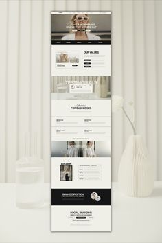 a white vase with flowers on top of it next to a webpage design for a hair salon