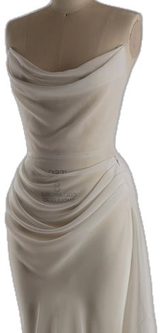 a white dress on a mannequin dummy with the top draped over it's head