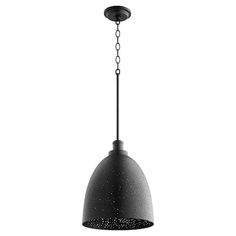 a black and white photo of a light hanging from a ceiling fixture with chains attached to it