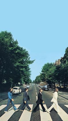 the beatles are walking across the street