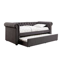 a couch with a pull out bed underneath it