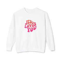 Cute & trendy neon pink and orange Jesus Loves You comfy crewneck!  This custom crewneck sweatshirt brings both incredible quality and amazing style to the mix. Made with soft, ring-spun cotton fabric with 100% cotton threads, it sits unmatched when it comes to softness. All sweatshirts feature a rolled forward shoulder and are printed with OEKO-TEX-certified low-impact dyes. Lastly, Comfort Colors is a proud member of the US Cotton Trust Protocol which means sustainable cotton sourcing that's good for the environment.  .: 100% ring-spun cotton .: Light fabric (6.4 oz/yd² (217 g/m .: Relaxed fit .: Sewn-in twill label Loves You, Custom Crewneck Sweatshirts, Comfy Crewneck, Custom Crewneck, Jesus Shirts, Jesus Loves You, Comfort Color, Soft Ring, Jesus Loves