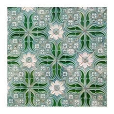 an abstract green and white tile pattern with flowers in the center, as well as circles