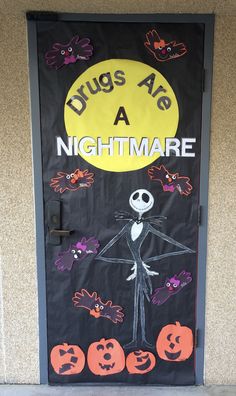 a door decorated with halloween decorations and words