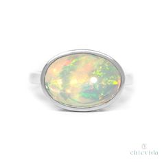 DetailsMade to orderMaterial: 14k/18k GoldColor Options: Yellow Gold, White Gold, Rose Gold★ Center StoneOpal, OvalSize: 9x11 mm ApproxApprox Weight (Ct): 5 CTW Approx Luxury Silver Opal Ring With Bezel Setting, Phone Items, Natural Gemstone Jewelry, 18k Gold Ring, Recycled Gold, Opal Ring, White Rose Gold, Opal Rings, Free Giveaway