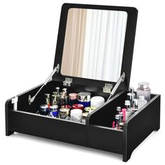 an open makeup box with all the contents in it's compartment and its lid opened