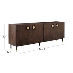 the sideboard has three brass knobs on it and is shown in dark wood