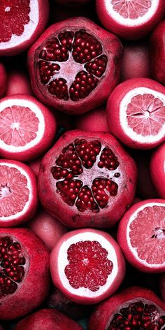 the pomegranates are cut in half and ready to be eaten