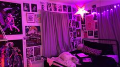 a bedroom with purple lights and pictures on the walls, including a star hanging from the ceiling