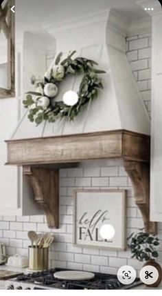 a kitchen with a wreath on top of the stove