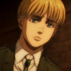 an anime character with blonde hair wearing a suit and tie, staring at the camera