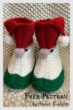 two knitted slippers with red and green trims on the bottom, one wearing a santa claus hat