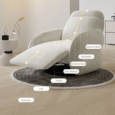 a white recliner chair sitting on top of a wooden floor