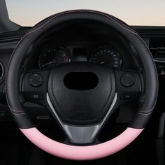 the steering wheel cover is pink and black