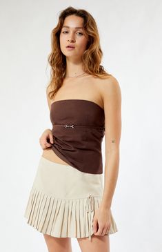 Step into chic sophistication with the LA Hearts Beige Micro Pleated Mini Skirt. This versatile piece features delicate micro pleats that add a touch of texture, making it the perfect choice for elevating your day-to-night looks.


	13" center front length
	Lined
	Built-in interior shorts
	Pleated design
	Tie side detail
	Low-rise
	Side zipper closure
	55% rayon, 45% linen; Lining: 95% polyester, 5% spandex
	Hand wash
	Model is wearing a size small
	Model measurements: 5’7” height, 32” bust, 24” waist, 34” hip Linen Mini Skirt, Slim Fit Cargo Pants, Jeans Kids, Kids Swimwear, Slim Fit Pants, Night Looks, Pleated Mini Skirt, Skirted Swimwear, Dress Romper