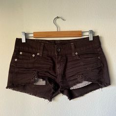 Carmar Denim Short Shorts Purchased From Lf Store. Dark Brown Color. Size 27. Peekaboo Pockets. Wrinkles And Tears Are Part Of The Design. Never Worn. Approx Lay Flat Measurements: Front: 8” Side: 9” Back: 11” Waist: 16” Denim Short Shorts, Brown Shorts, Dark Brown Color, Denim Short, Short Shorts, Vintage Brown, Black Shorts, Brown Color, Lay Flat