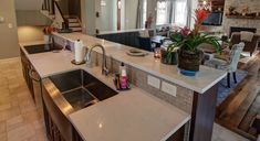 a kitchen with an island and sink in it