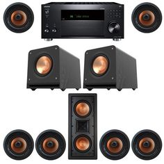 an array of speakers and subwoofers on a white background