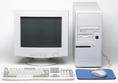 a desktop computer sitting next to a keyboard and mouse