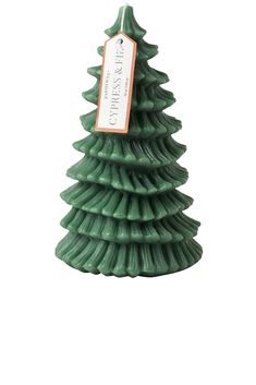 a green ceramic christmas tree with a tag on it