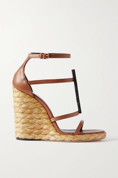 SAINT LAURENT's 'Cassandra' sandals are a sophisticated choice for your next summer party. Made in Italy, they're topped with supple brown leather straps accented by iconic logo hardware and rest on supportive jute wedges - a perfect match for the brand's 'Envelope' bag. How To Style Espadrilles, Style Espadrilles, Pink Espadrilles, Latest Sandal, Brown Wedge Sandals, Ankle Strap Wedges, Black Espadrilles, Brown Leather Sandals, Black Wedge Sandals