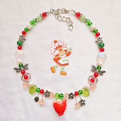 handmade beaded necklace inspired by Strawberry Shortcake! ♡ this necklace is made with Czech glass, faux pearls, and glass and metal beads! it also comes with a stainless steel extender chain ♡ Strawberry Necklace Tutorial, Strawberry Seed Bead Necklace, Strawberry Choker, Strawberry Shortcake Necklace, Strawberry Pearl Necklace, Strawberry Necklace, Handmade Beaded Necklace, Handmade Beaded Necklaces, Strawberry Shortcake