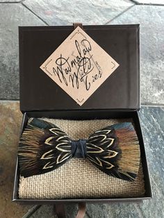 a box that has a bow tie in it