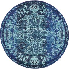 a blue rug with an ornate design on the center and bottom, in front of a white background