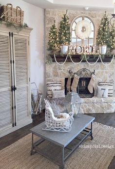 a living room filled with furniture and a fire place covered in christmas decorations next to a fireplace