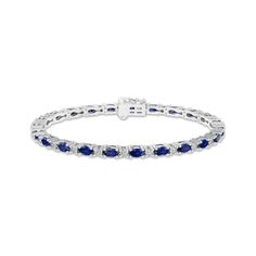 Sumptuous oval-cut blue lab-created sapphires sparkle in sterling silver links across this charming bracelet for her. Dainty white lab-created sapphire accents add extra allure. Measuring 7.25 inches, the bracelet secures with a box clasp. Blue Oval Sapphire Diamond Bracelet, Blue Sapphire Oval Tennis Bracelet, Blue Oval Sapphire Tennis Bracelet, Blue Oval Diamond Bracelet For Anniversary, Classic Oval Sapphire Tennis Bracelet, Classic Sapphire Oval Tennis Bracelet, Oval Blue Diamond Bracelets, Blue Oval Diamond Bracelet With Gemstone, Charming Bracelet