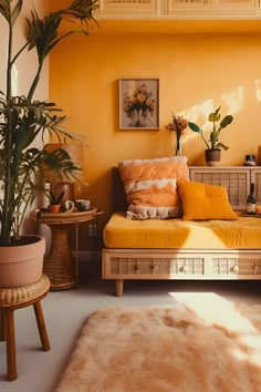 a living room filled with furniture and plants