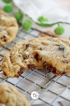 chocolate chip cookies cooling on a wire rack with green peas in the background and text overlay