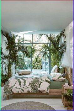 a bed room with a neatly made bed and lots of plants