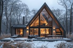 a house in the woods with snow on the ground