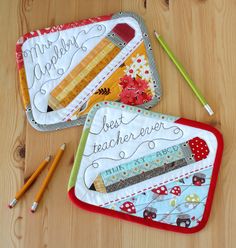 two placemats with writing on them and pencils