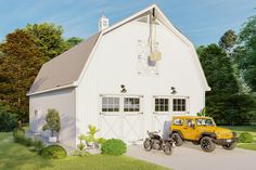 a yellow truck parked in front of a white barn with two bicycles on the driveway