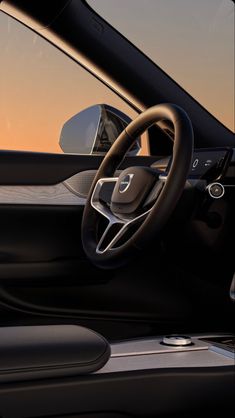 the interior of a modern car with steering wheel and dashboard, in front of an orange sky