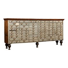 an old wooden cabinet with many drawers